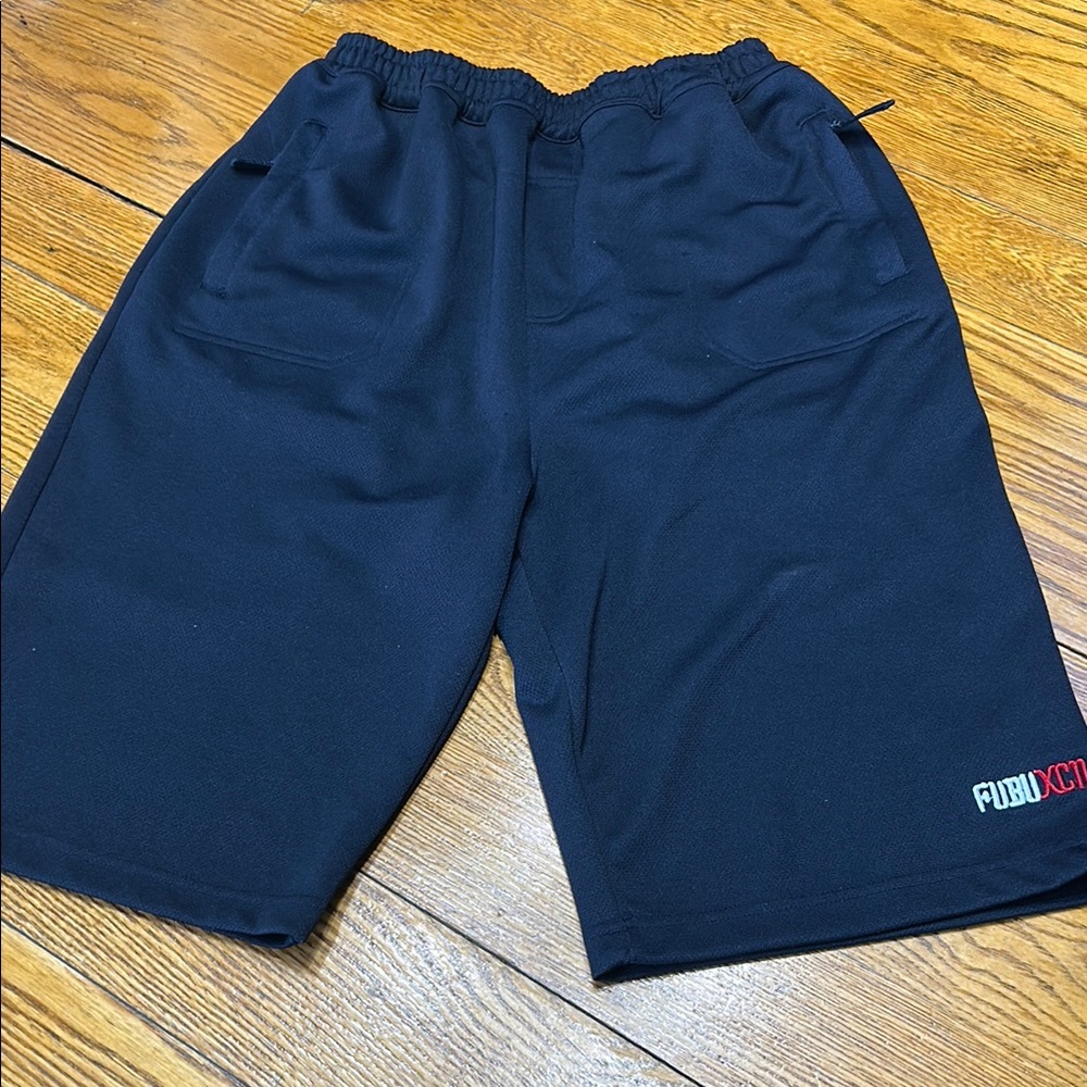 FUBU XCM navy blue athletic shorts. Elastic waist.Zip pockets. Boy’s Size 20.